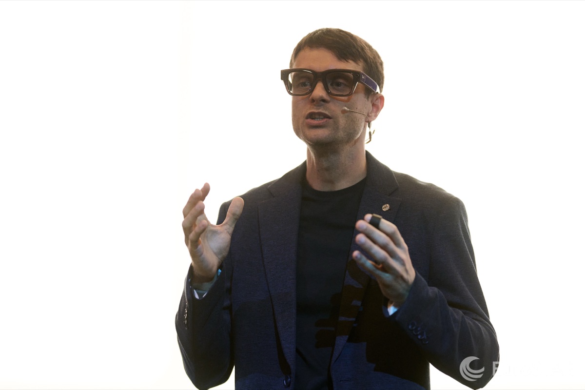 Evgeny Tkachenko presenting “Redefining Quality for AI-Powered Systems” on stage at EuroSTAR Conference 2026